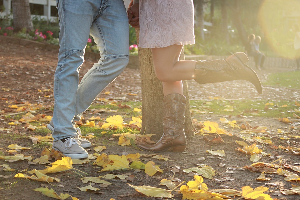 couple in autumn leaves